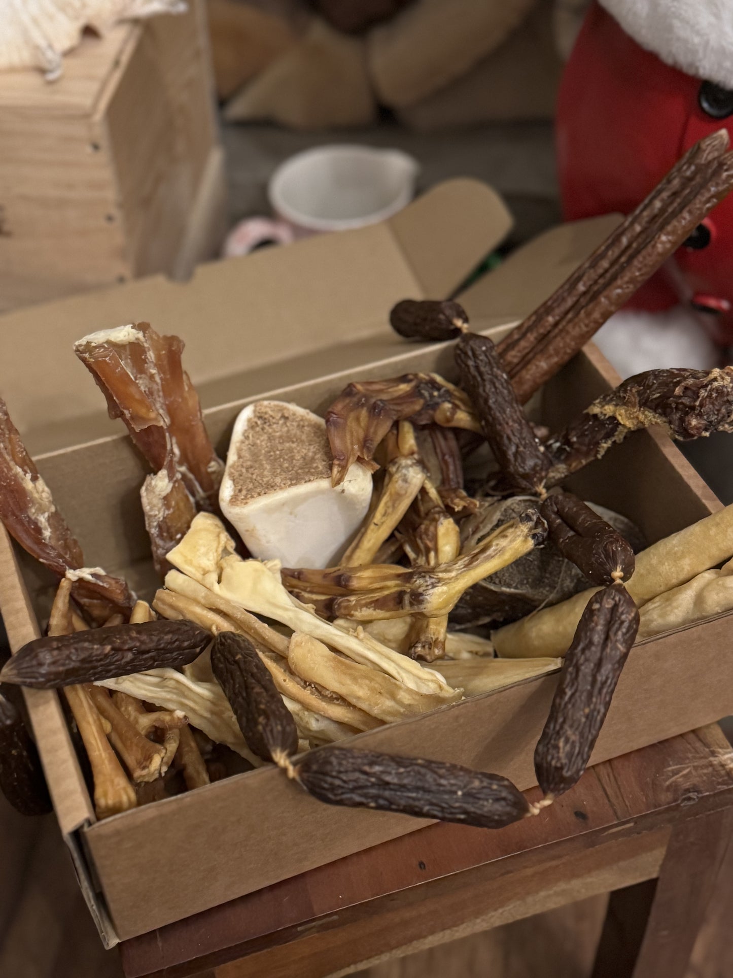 Christmas treat dog gift box sausages, turkey bones, lamb, duck
