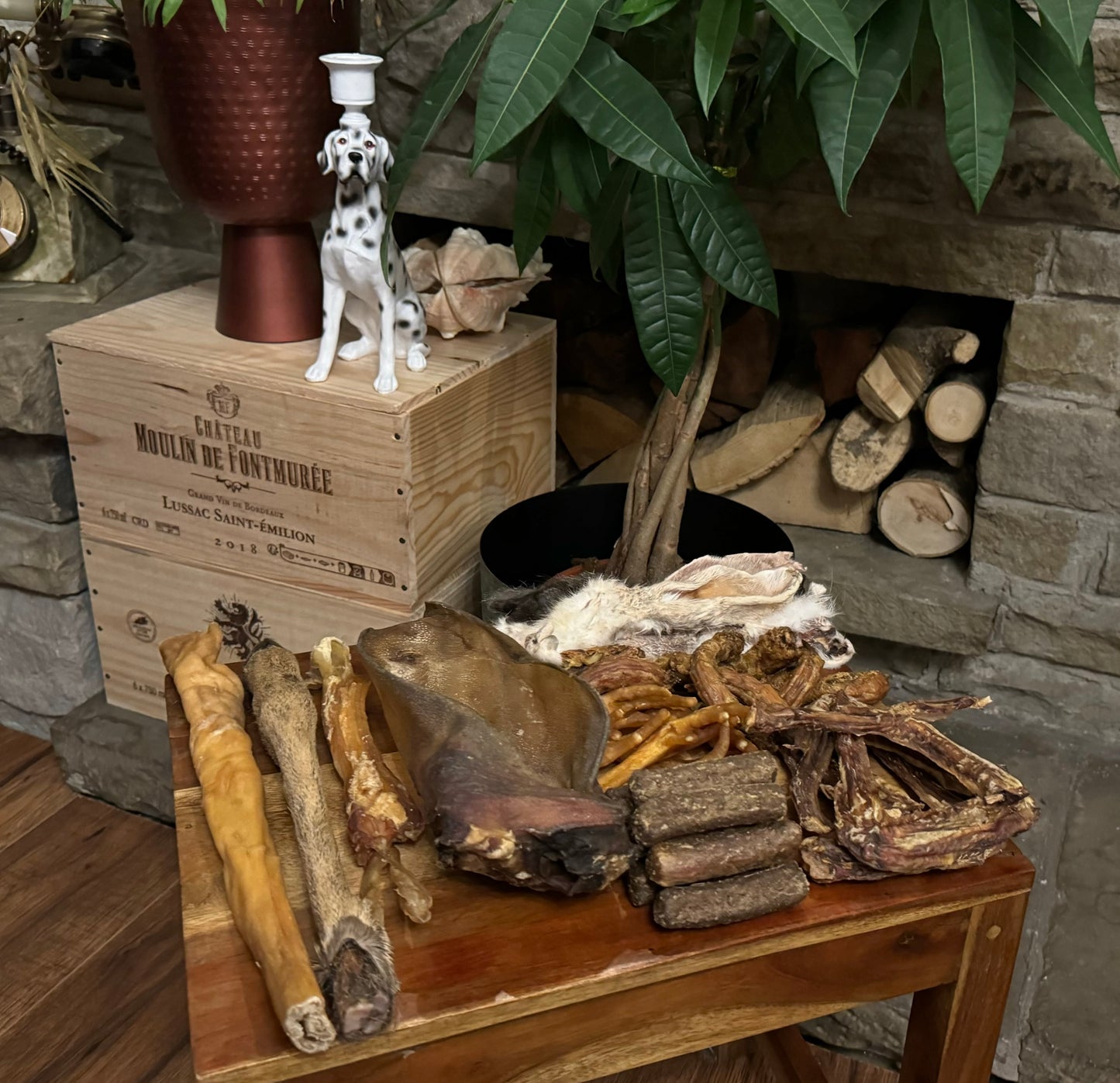 Spooky Halloween dog treat box deer legs, chicken feet and necks, duck wings, chewy beef tendons, buffalo ears, goat rolls, sausages, rabbit ears. 