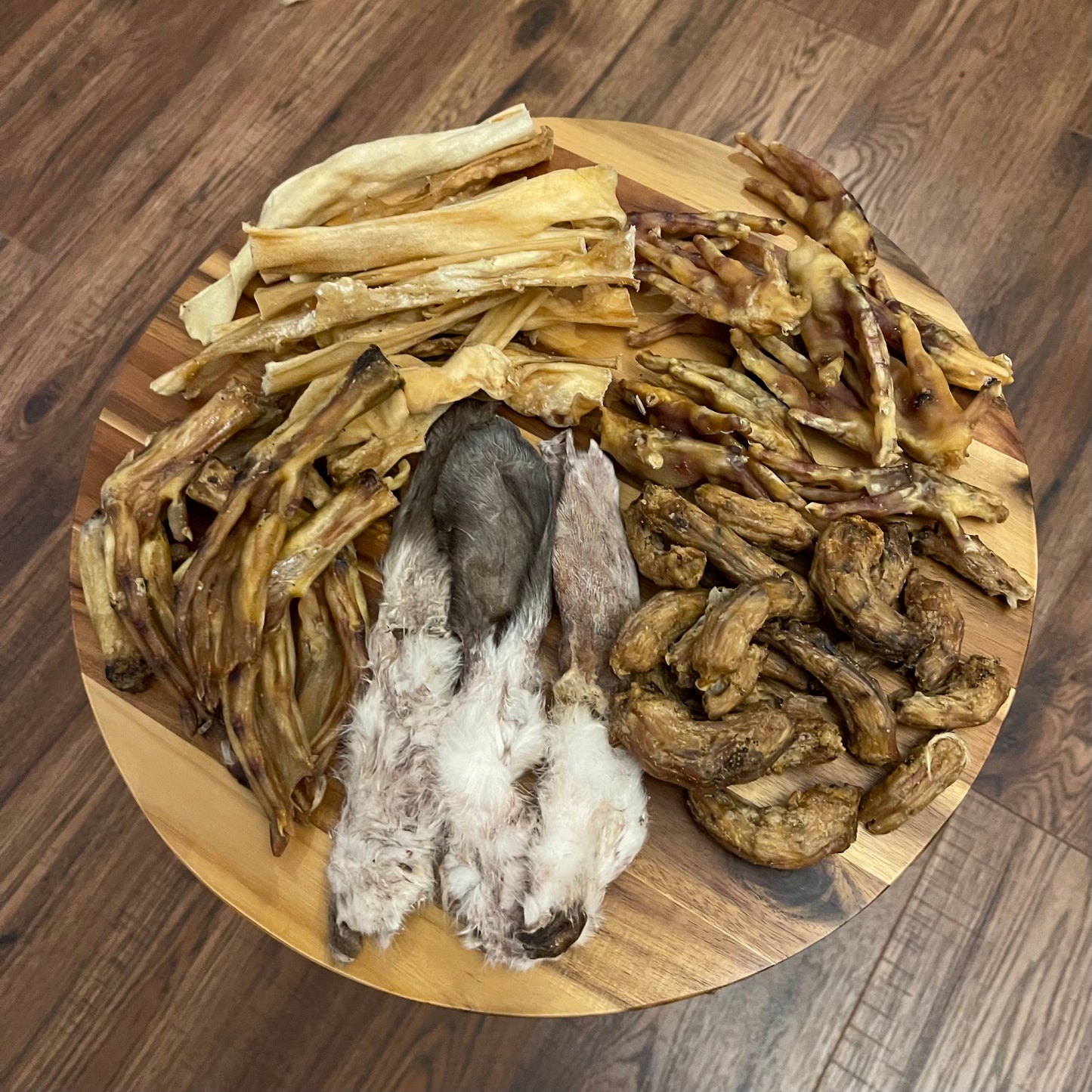 Easter treat box for dogs with chicken feet, chicken necks, chewy lamb skin, rabbit ears and duck feet